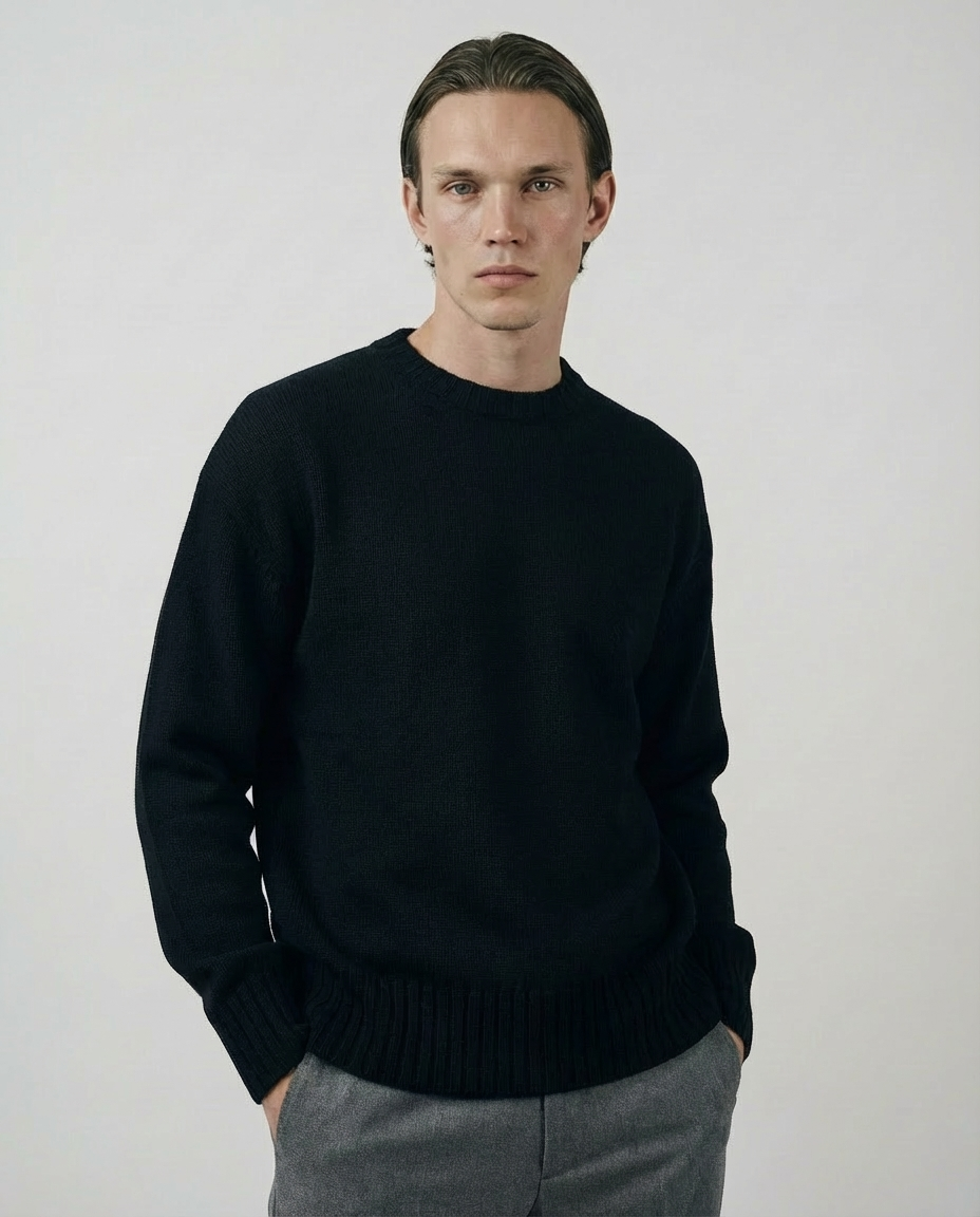 man wearing a dark black crewneck sweater made in italy casa nodale merino wool and cashmere