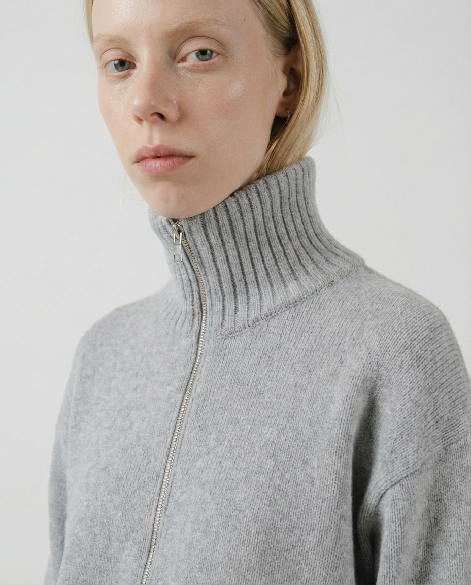woman wearing a light gray zip-up cardigan sweater made in italy casa nodale merino wool and cashmere