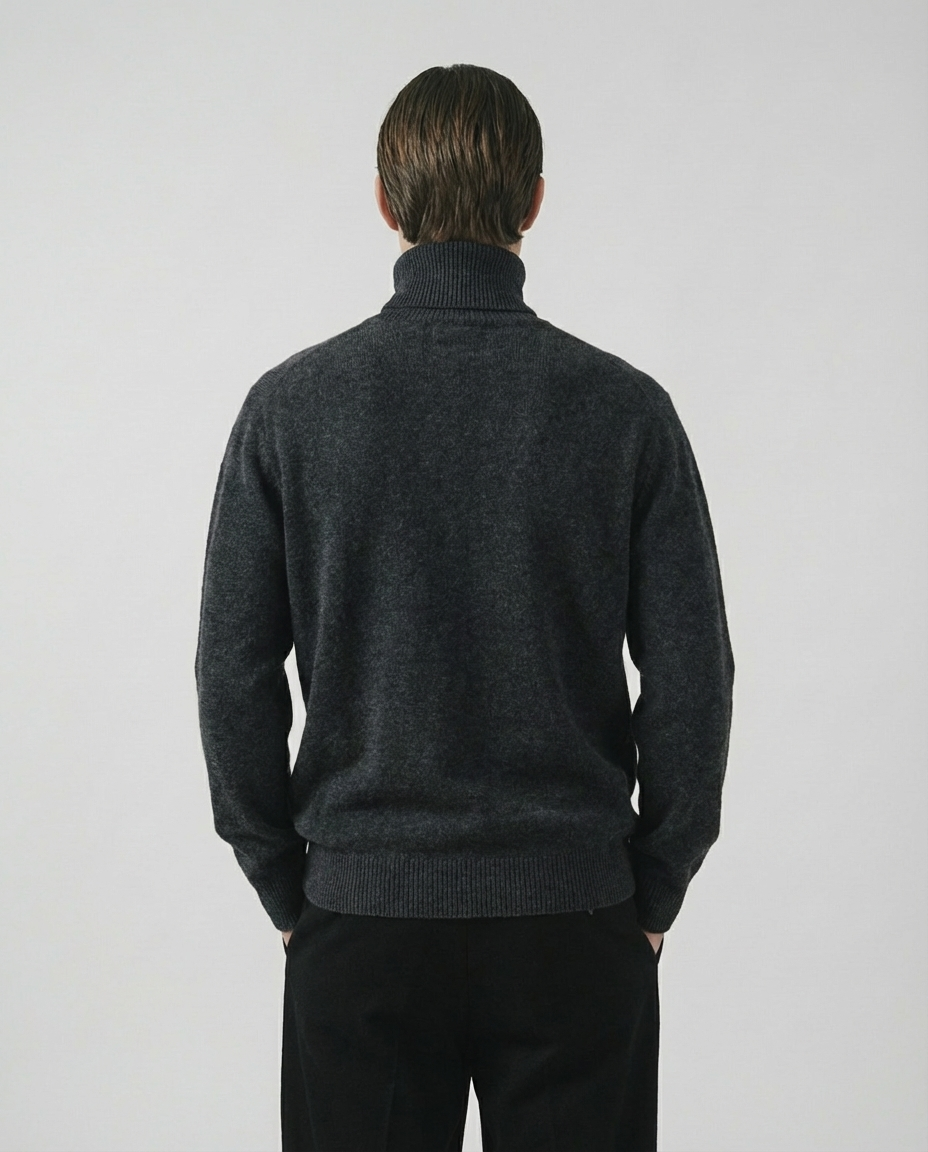man wearing a dark gray charcoal turtleneck sweater made in italy casa nodale merino wool and cashmere