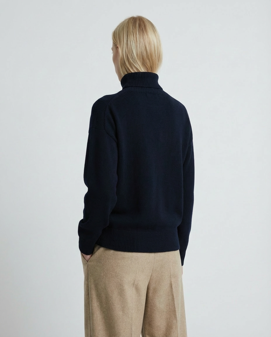 woman wearing a dark blue navy turtleneck sweater made in italy casa nodale merino wool and cashmere