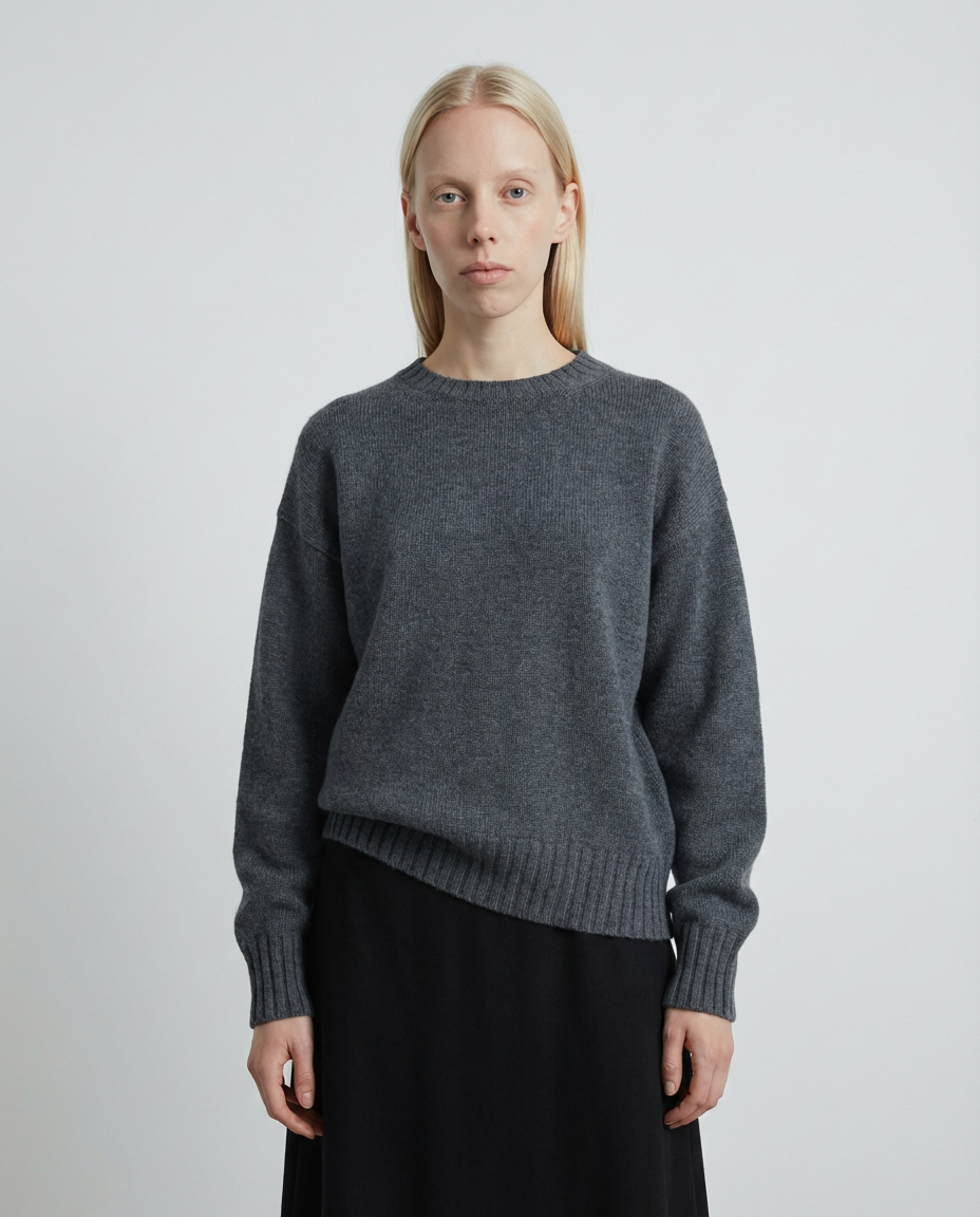 woman wearing a dark gray charcoal crewneck sweater made in italy casa nodale merino wool and cashmere