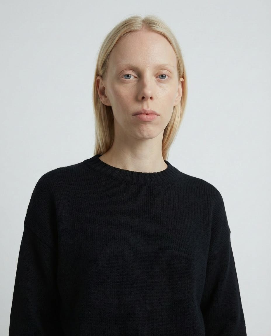 woman wearing a dark black crewneck sweater made in italy casa nodale merino wool and cashmere
