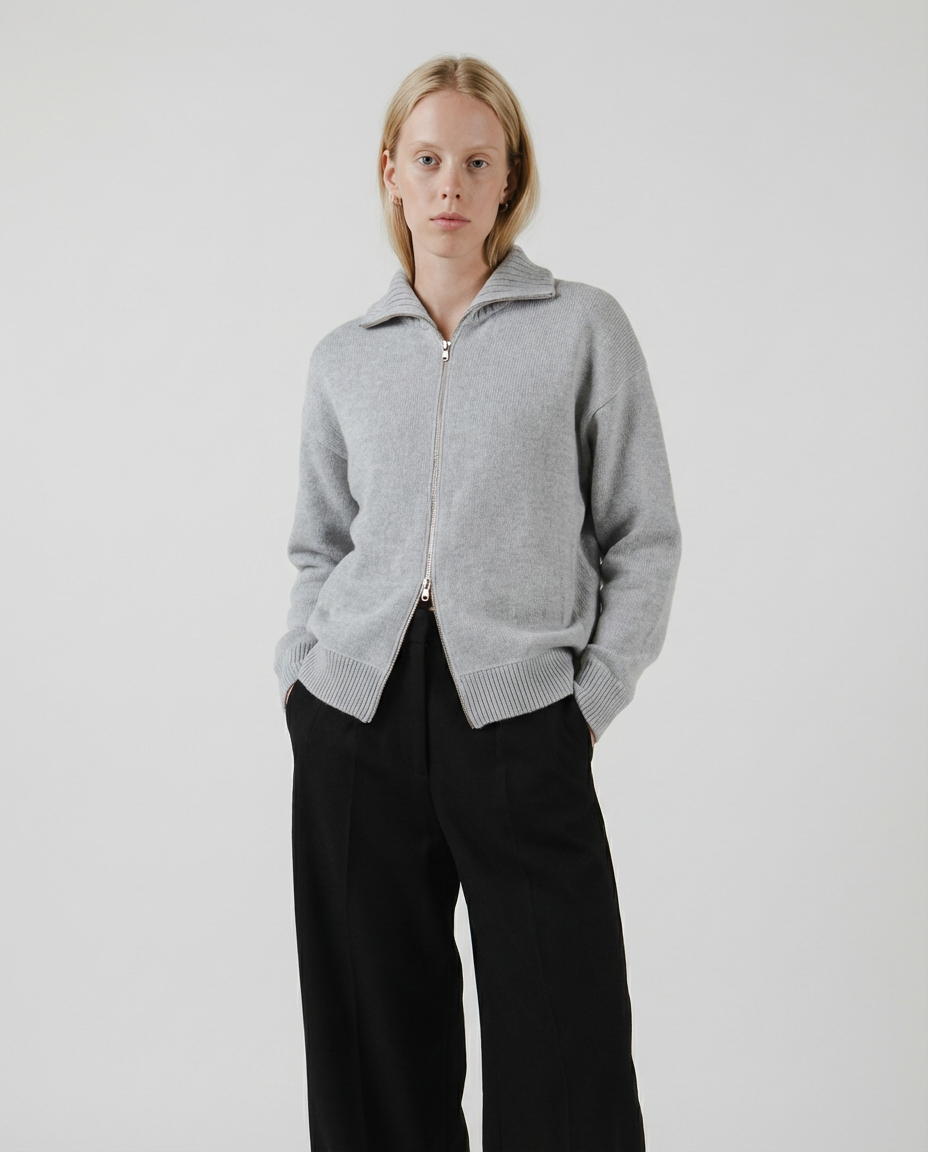 woman wearing a light gray zip-up cardigan sweater made in italy casa nodale merino wool and cashmere